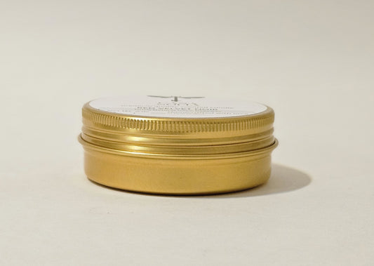 Vela artesanal de violeta-rosa-raspberry en envase reciclable